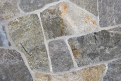 A bi-color gray stone running the range of dark gray with a lot of brown shading to an almost white-gray with very little brown. Our most popular stone. We highly recommend tht you purchase all of this stone your will need for a single project at one time due to the considerable variation in color. With a bed thickness of 1 ½” to 2 ½” thick with a face range of 12” to 36”. Average coverage is approximately 100 square feet per ton.
